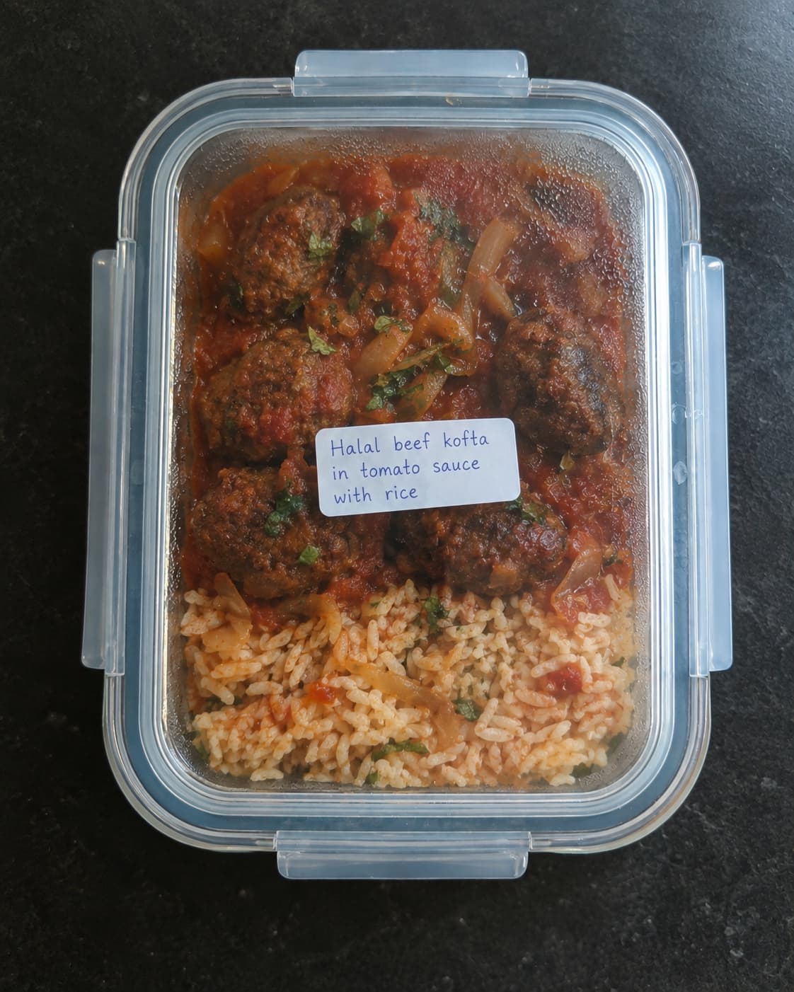 Halal beef kofta in tomato sauce with rice