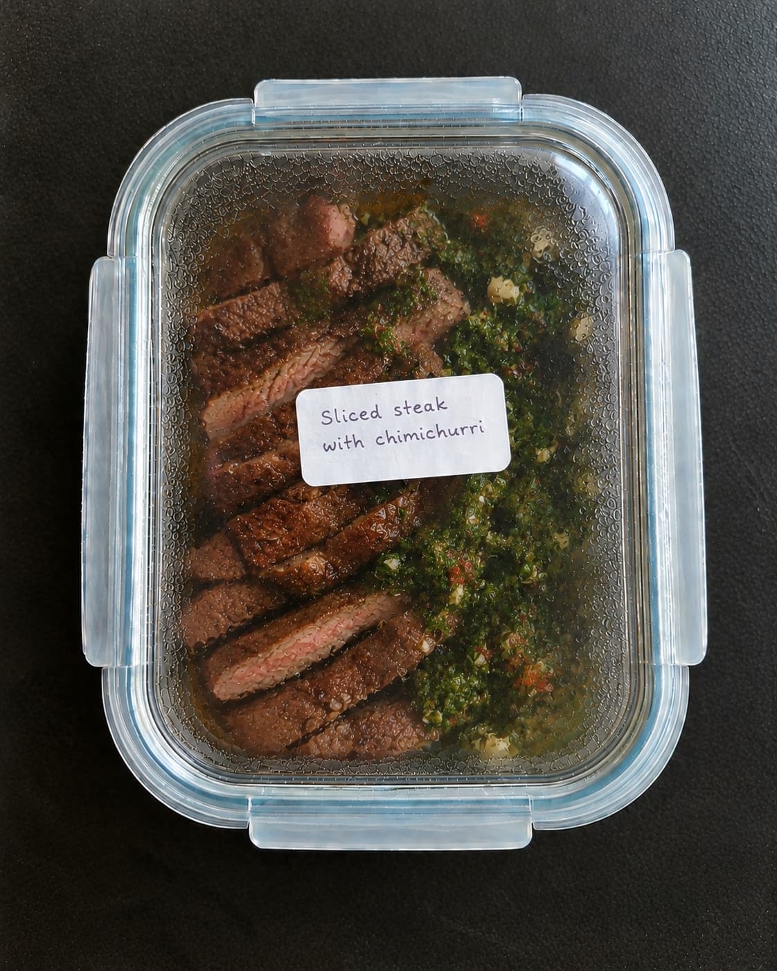 Sliced steak with chimichurri